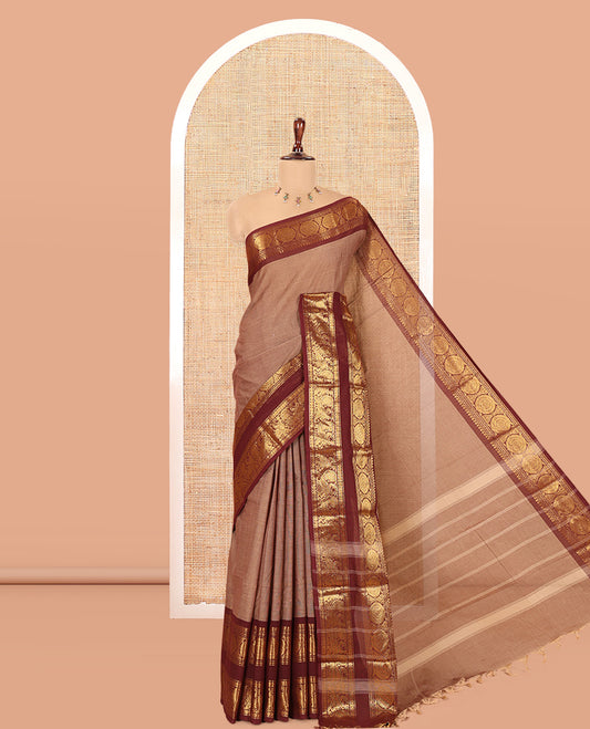 Brown Plain Chettinad Cotton Saree, Complemented by a Contrast Peacock-Chakram Rettai Pettu Border, and a Matching Blouse