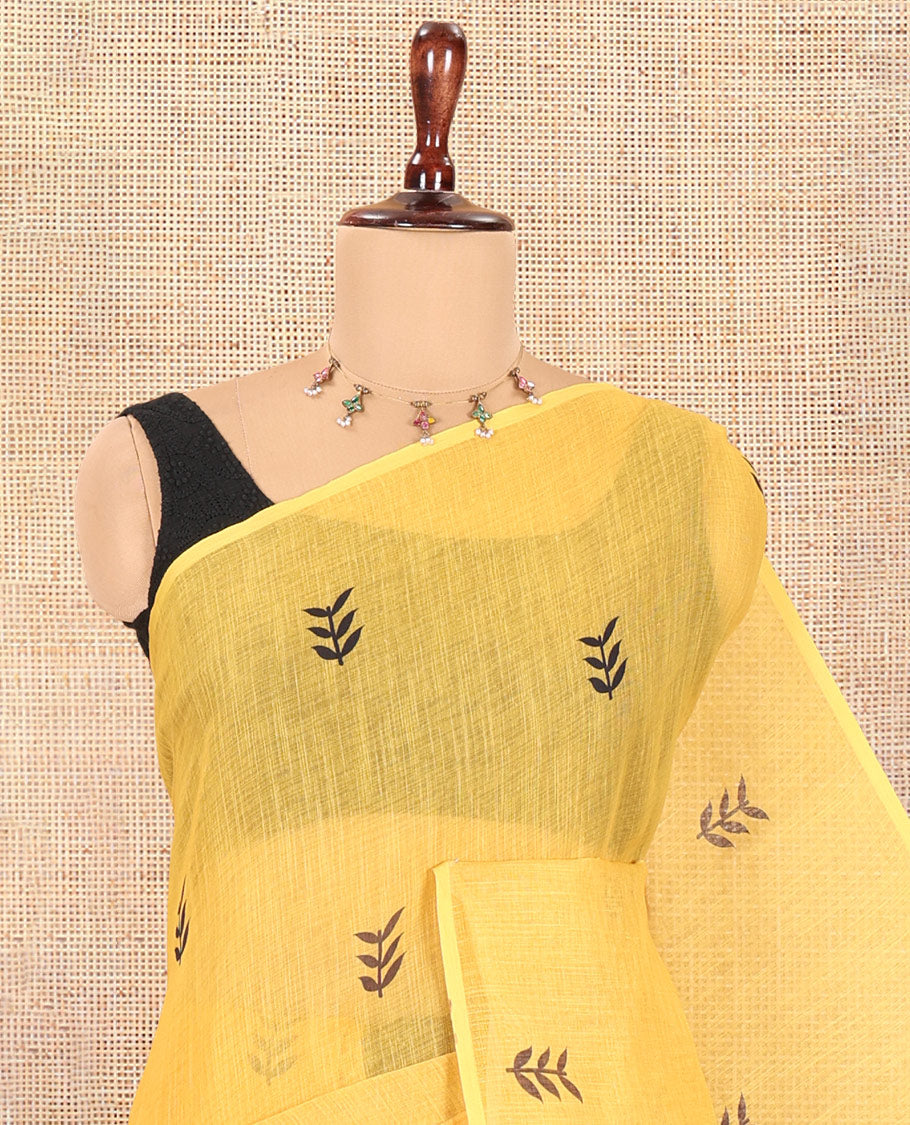 Borderless Yellow Linen Cotton Saree, Adorned with Leaf Print, a Contrast Leaf-Printed Pallu, and Contrast Blouse