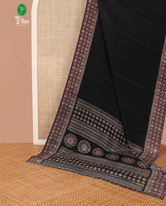Black turkey crepe saree with ajrakh printed border & ajrakh printed pallu along with printed blouse
