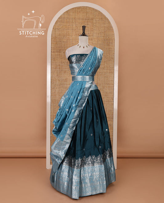 Bottle green-blue taffeta silk half-saree, zari buttas & contrast floral-geometric zari border skirt, zari woven blouse & contrast zari woven dhavani