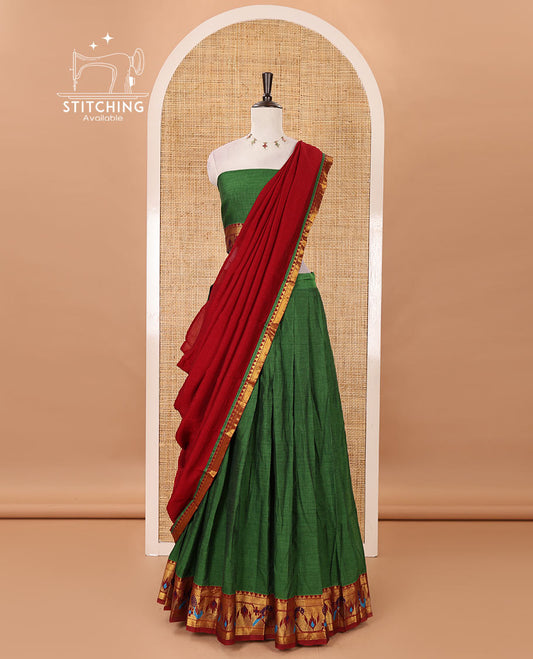 Green mercerised cotton half-saree, plain & contrast paithani peacock border skirt, matching blouse & contrast plain zari border dhavani