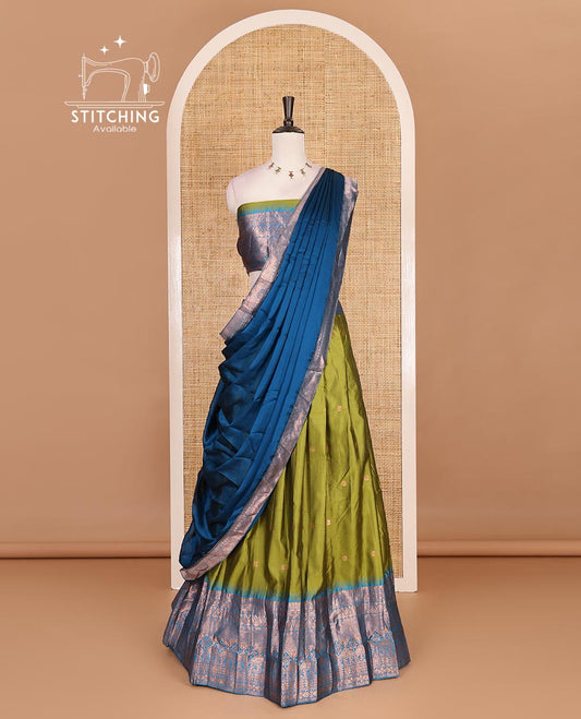 Green taffeta silk half saree, zari buttas with contrast blue traditional zari border skirt, matching zari design blouse, and contrast plain zari border syska georgette dhavani