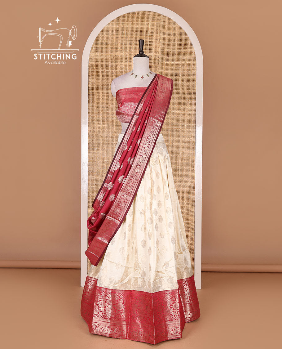 Cream with rani pink semi-banarasi half-saree, zari buttas with contrast traditional zari border skirt, zari jacquard blouse, and zari design dhavani
