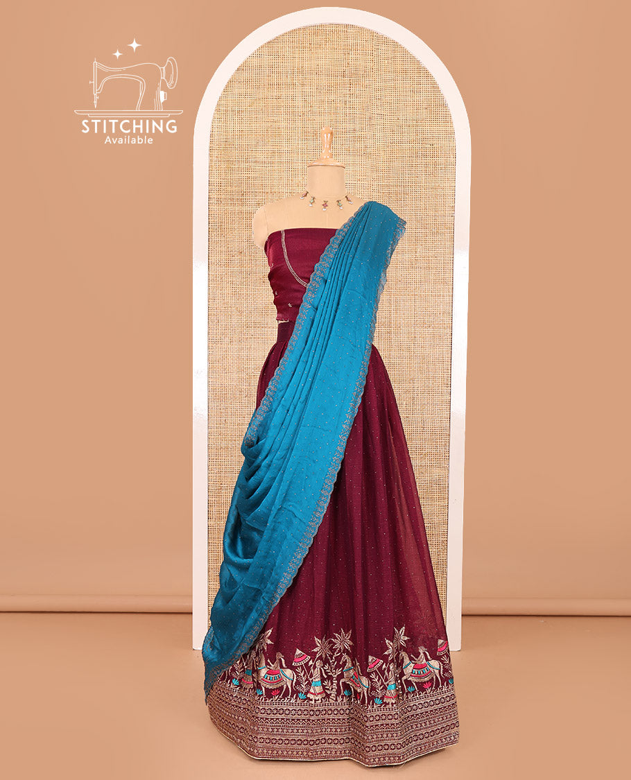 Wine half-saree, Swarovski stone work with girl-on-the-horse motifs embroidered bordered satin georgette skirt, a matching satin georgette blouse, and a contrast Swarovski stone work scallop dhavani