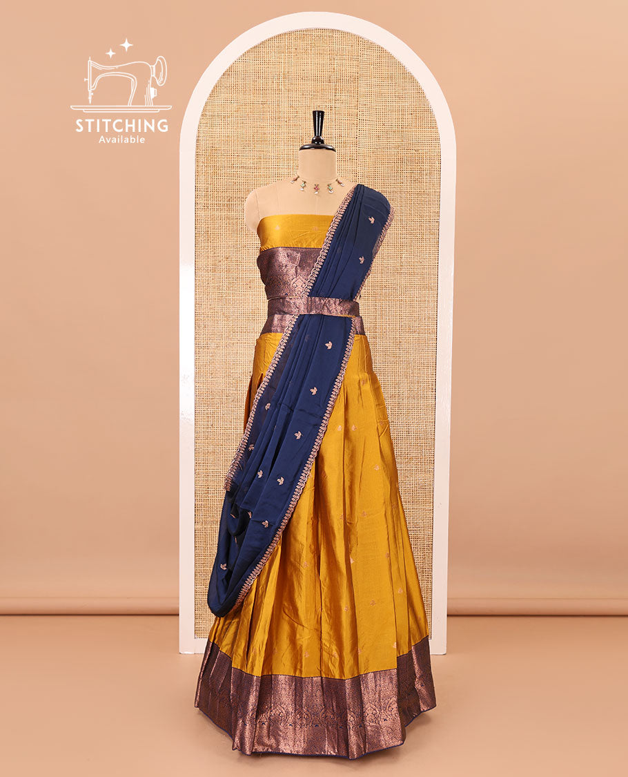 Mustard taffeta silk half-saree, zari buttas with contrast traditional zari bordered skirt, matching zari design blouse, and contrast scallop buttas embroidered dhavani
