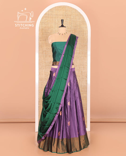 Lavender and green half-saree with paisley buttas with contrast traditional bordered taffeta silk skirt, a matching blouse, and a contrast bordered syska georgette dhavani