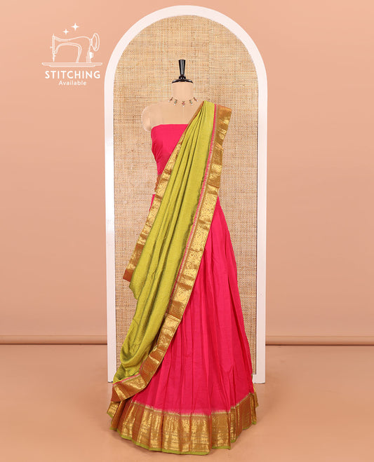 Rani Pink and Parrot Green Chettinad Cotton Half-Saree Featuring a Plain Skirt, Highlighted with a Contrast Floral-Peacock Zari Border, a Subtly Woven Matching Blouse, and a Vichitra Silk Contrast Traditional Zari Bordered Dhavani