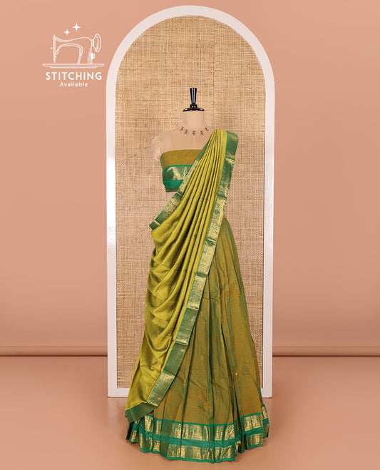 Mehendi Green and Green Chettinad Cotton Half-Saree Featuring Buttas Woven Skirt, Highlighted with a Contrast Rettai Pettu Peacock Motifs Woven Zari Border, a Subtly Woven Matching Blouse, and a Vichitra Silk Contrast Traditional Zari-Bordered Dhavani