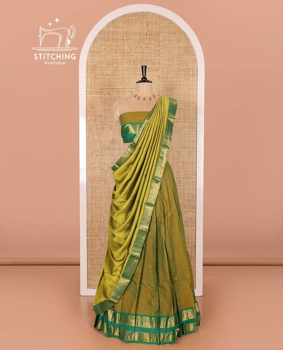Mehendi Green and Green Chettinad Cotton Half-Saree Featuring Buttas Woven Skirt, Highlighted with a Contrast Rettai Pettu Peacock Motifs Woven Zari Border, a Subtly Woven Matching Blouse, and a Vichitra Silk Contrast Traditional Zari-Bordered Dhavani