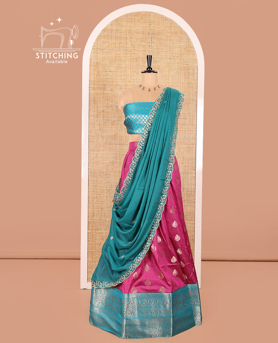 Rani Pink and Ferozi Color Semi-Banaras Silk Half-Saree Featuring Zari  Buttas All Over the Skirt, Highlighted with a Contrast Traditional Zari Design Border, Rudraksham Motifs Woven Blouse, and a Shimmer Georgette Scallop-Embroidered Dhavani