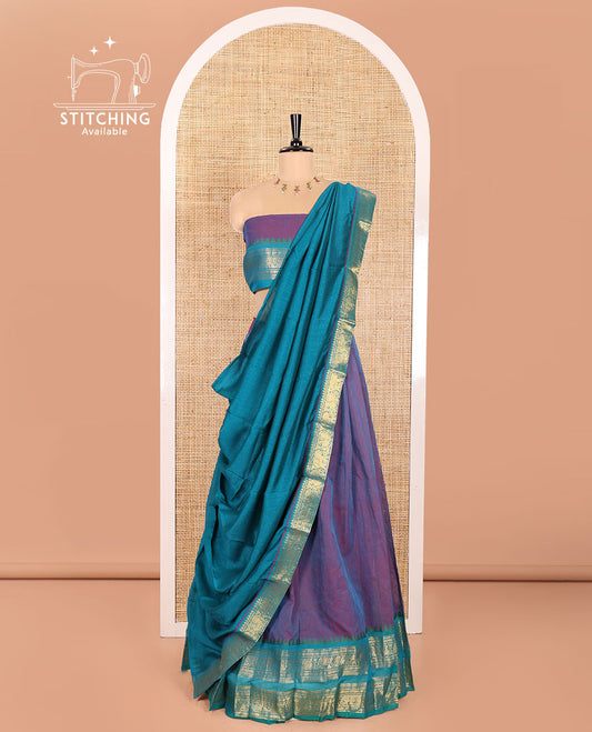 Purple Chettinad Cotton Half-Saree Featuring a Plain Skirt, Highlighted with a Contrast Peacock-Elephant Motifs Woven Rettai Pettu Zari Border, a Subtly Woven Matching Blouse, and a Vichitra Silk Contrast Traditional Zari-Bordered Dhavani