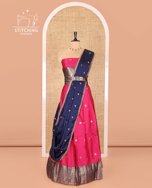 Pink and Navy Blue Semi-Banarasi Half-Saree, Adorned with Zari Buttas on Its Skirt, Complemented by a Contrast Traditional Zari Designs Woven Border, Paired with a Matching Blouse, and a Satin Georgette Embroidered Scallop Dhavani