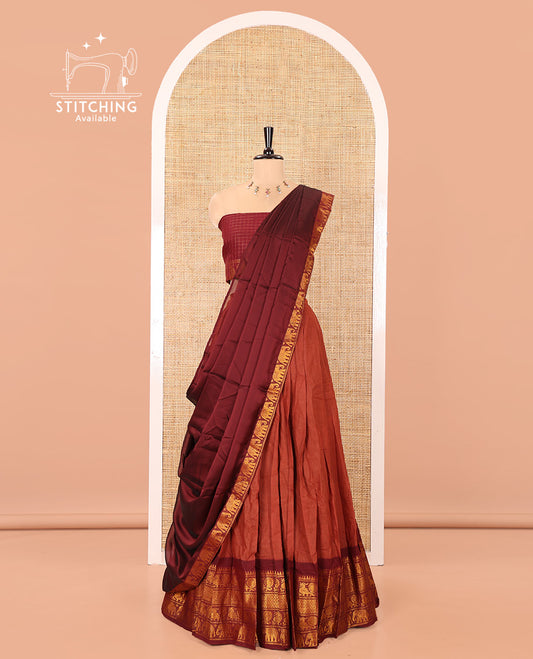 Rust and Maroon Plain Sungudi Cotton Half-saree, Complemented by Captivating Contrast Traditional Zari Border of Temple, Peacock, and Elephant Designs, Paired with a Contrast Zari Checked Blouse, and Comes with a Zari-Bordered Vichitra Silk Dhavani