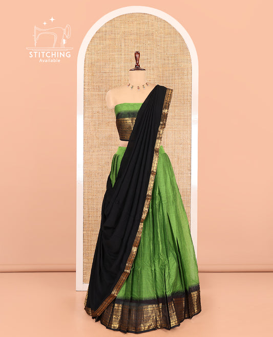 Leaf Green-Black Chettinad Cotton Half-Saree, Plain Contrast Traditional Zari-Bordered Skirt, Matching Blouse, and a Contrast Dhavani