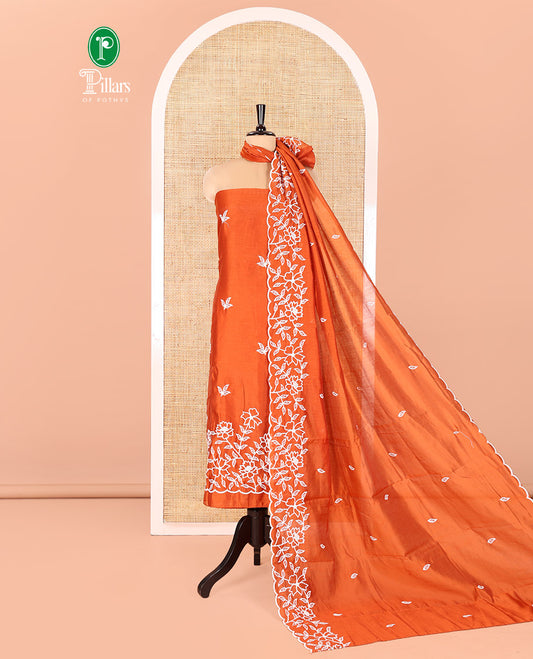 Rust Mul Chanderi Material Chudidar Set, Delicately Woven with Floral Embroidery on Its Top, a Plain Santoon Bottom, and Paired with a Floral Embroidered Scallop Dupatta
