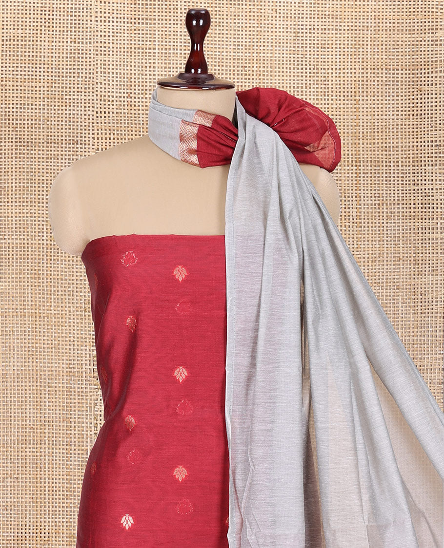 Maroon Semi-Chanderi Material Churidar Features Floral Buttas Top, a Plain Bottom, and a Contrast Dupatta