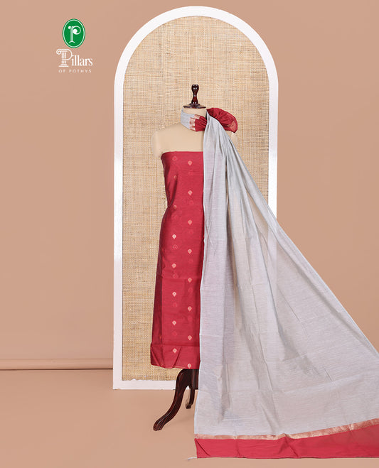 Maroon Semi-Chanderi Material Churidar Features Floral Buttas Top, a Plain Bottom, and a Contrast Dupatta