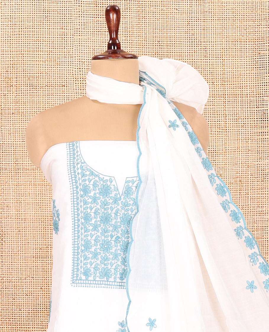 White-Blue Mul Chanderi Material Churidar Features a Floral-Themed Thread-Embroidered Top, a Plain Santoon Bottom, and Thread Embroidered Dupatta