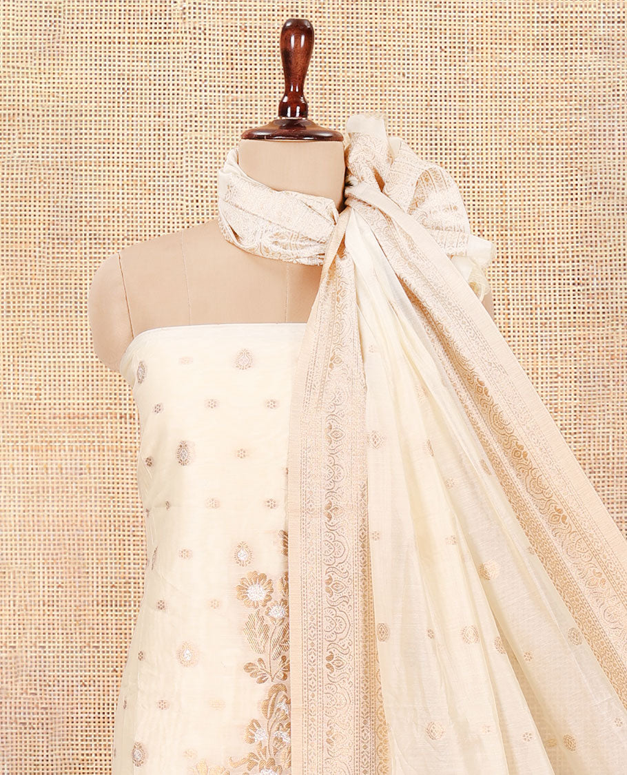 Kerala Cream Banarasi-Silk Material Churidar, Adorned with Floral Designs Top, a Plain Bottom, and Zari Design Dhavani