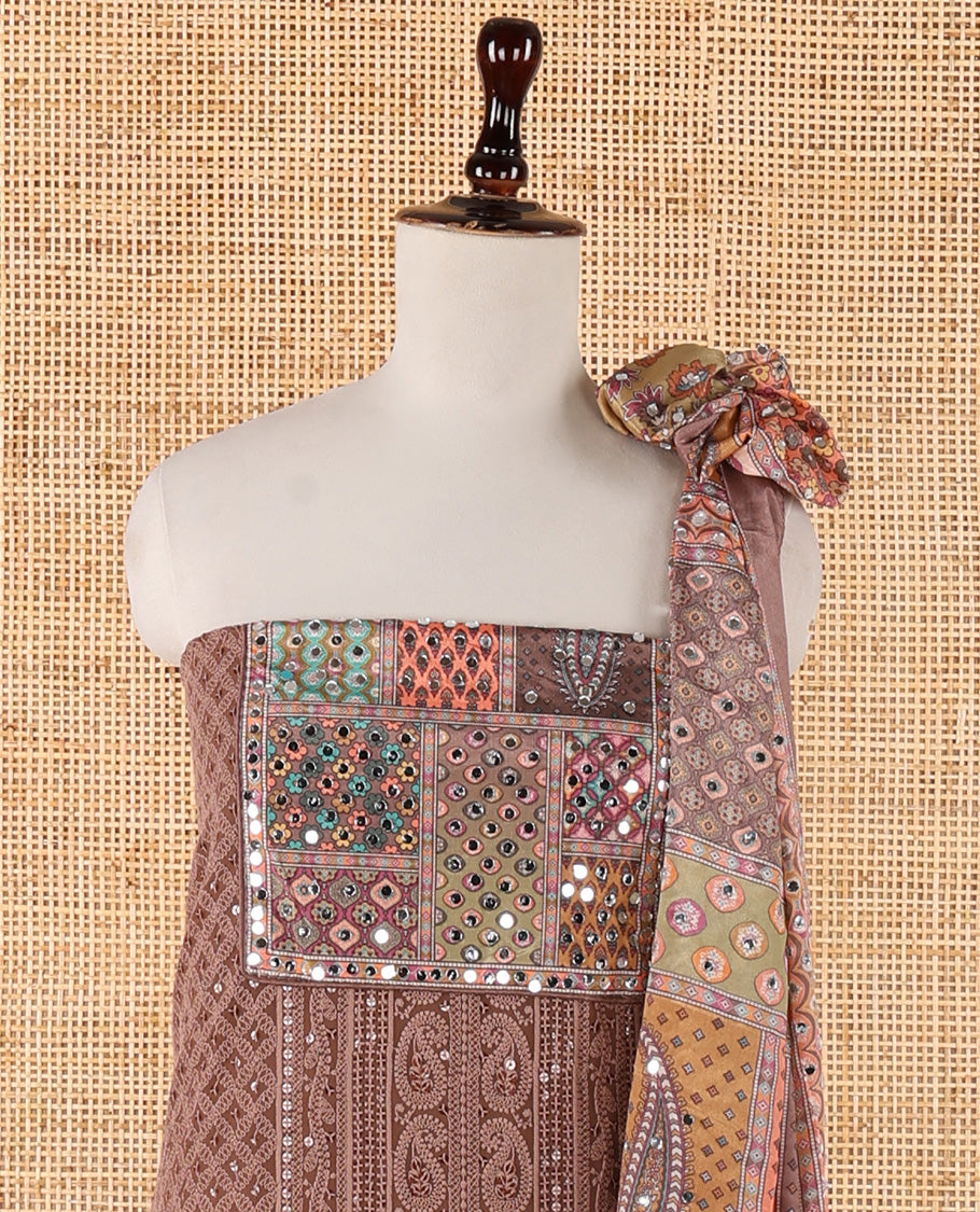 Brown churidar material set, Ajrakh-printed neck with Schiffli embroidery & mirror work georgette top, kalidoscopic-colored dupatta of ajrakh print & mirror embroidery & plain crepe bottom