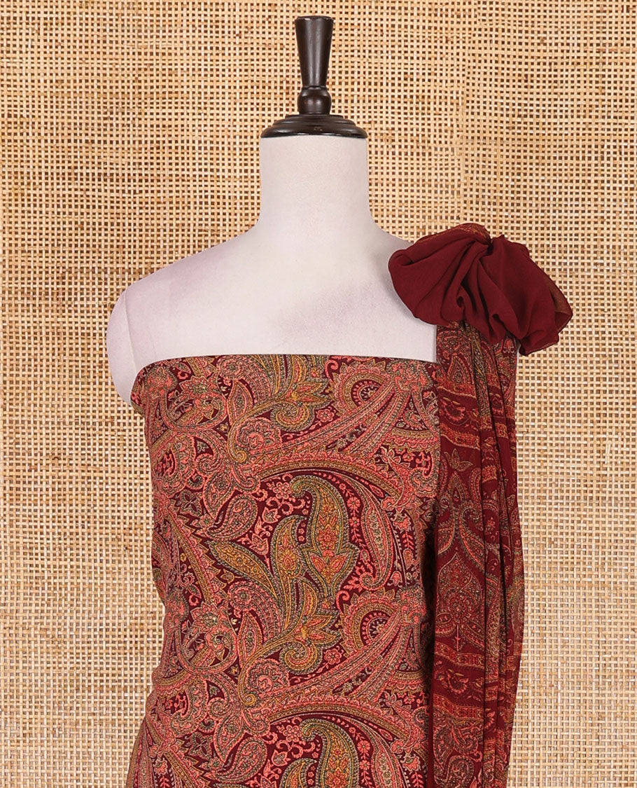 Reddish maroon Italian crepe material chudidar set, paisley printed top, plain bottom, and floral-paisley printed georgrette dupatta