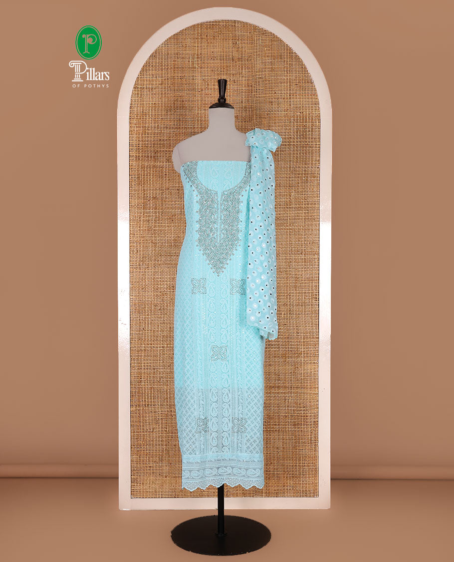 Blue material churidar set, stone work with Schiffli style embroidered georgette top, American Crape bottom, and polka dotted printed mirror work dupatta