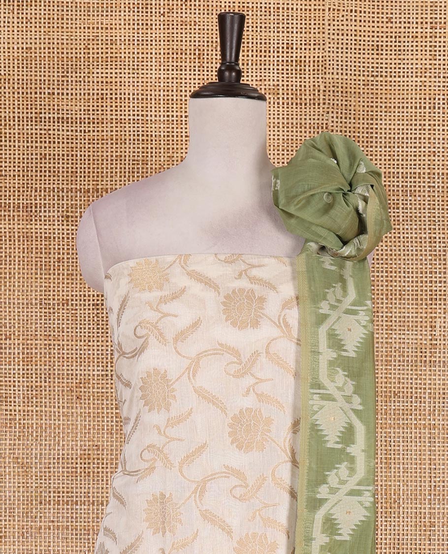Cream with pista green semi-chanderi material churidar set, floral jaal jacquard top, contrast taffeta silk bottom, and jamdani style dupatta