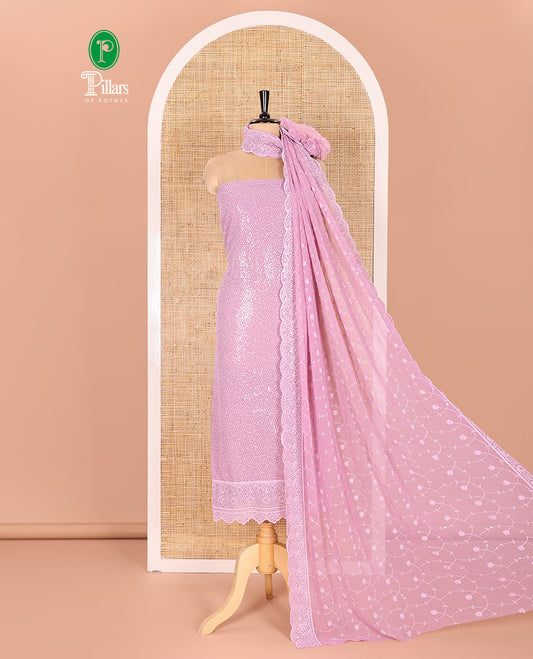 Lavender Material Chudidar Set Features Sequin Embroidered Georgette Top, a Plain American Crepe Bottom, and a Scallop Dupatta Embellished with Floral Vine Embroidery