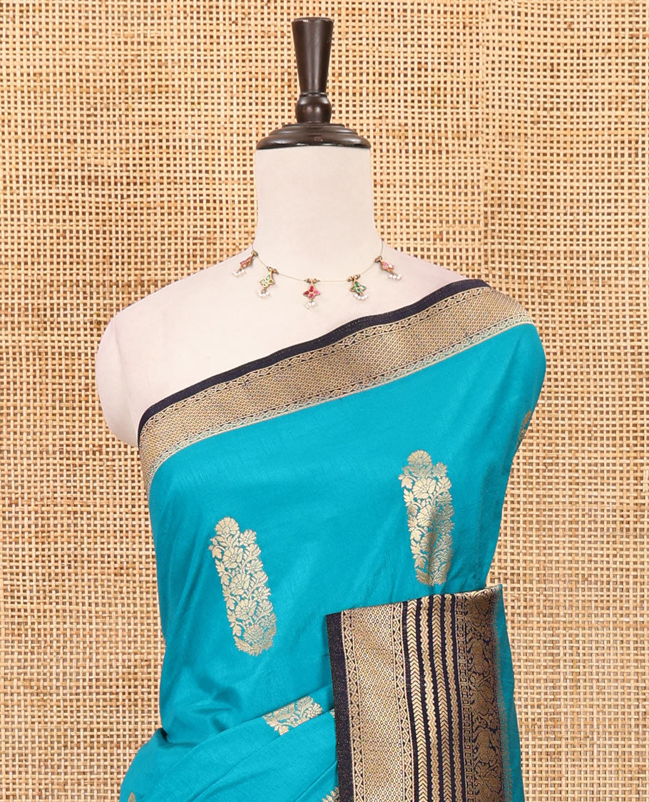 Peacock blue floral zari buttas dola silk saree, contrast traditional zari peacock border, diagonal floral zari striped pallu & contrast jacquard blouse
