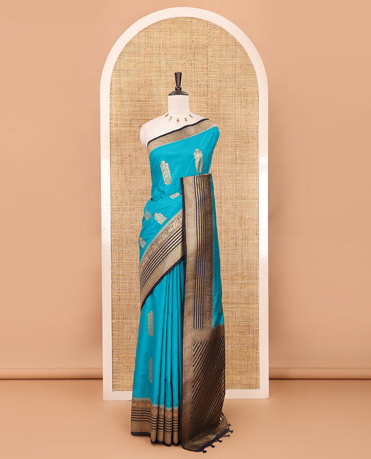 Peacock blue floral zari buttas dola silk saree, contrast traditional zari peacock border, diagonal floral zari striped pallu & contrast jacquard blouse