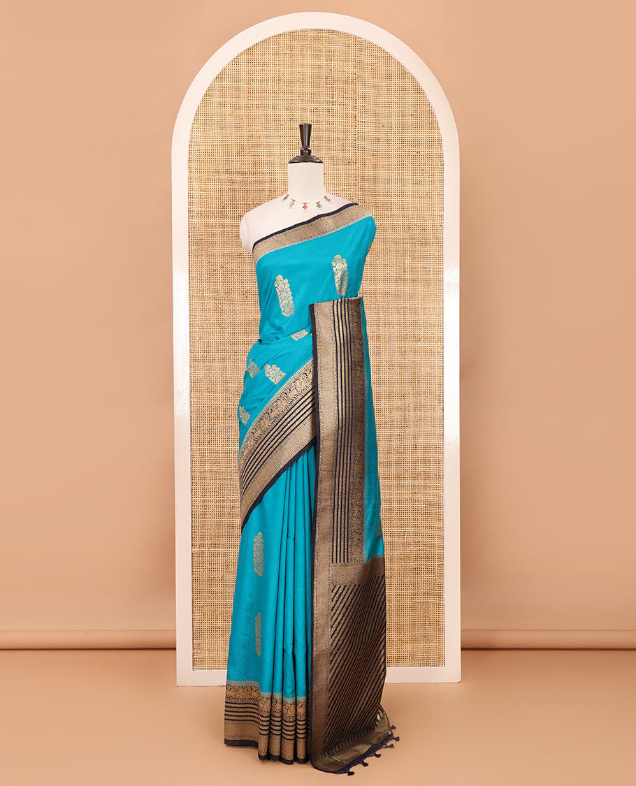 Peacock blue floral zari buttas dola silk saree, contrast traditional zari peacock border, diagonal floral zari striped pallu & contrast jacquard blouse