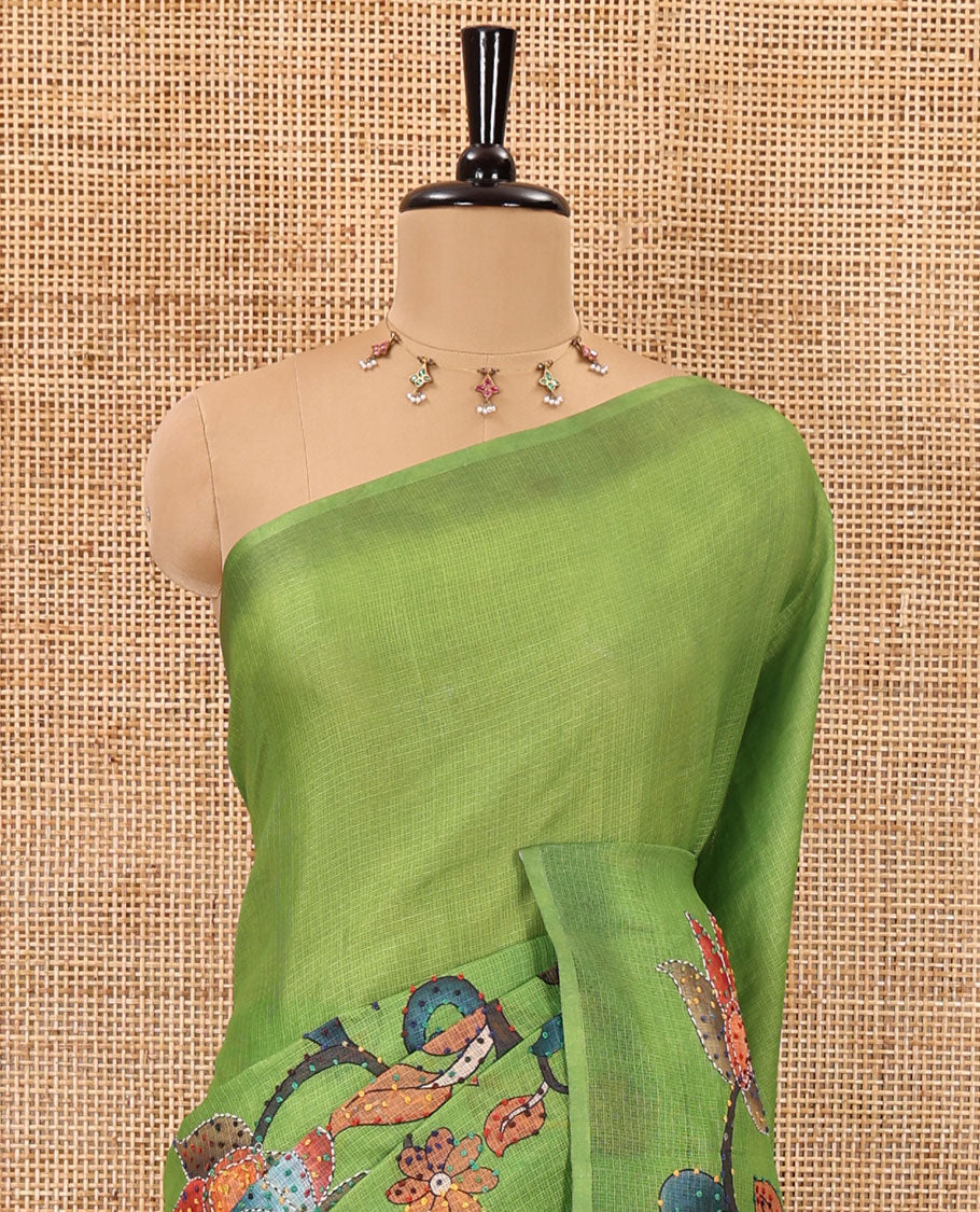 Borderless parrot green kalamkari floral vine printed with French knot and kanta embroidered kotta silk saree, printed and French knot embroidered matching blouse