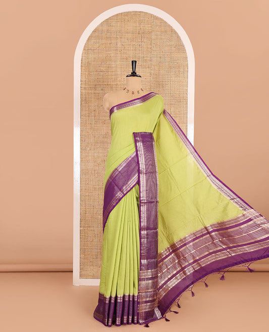 Pista green plain Assam silk saree, contrast traditional zari border of rudraksham motifs, zari striped pallu, and a contrast zari bordered blouse