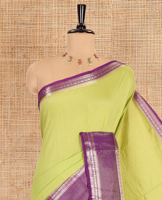 Pista green plain Assam silk saree, contrast traditional zari border of rudraksham motifs, zari striped pallu, and a contrast zari bordered blouse
