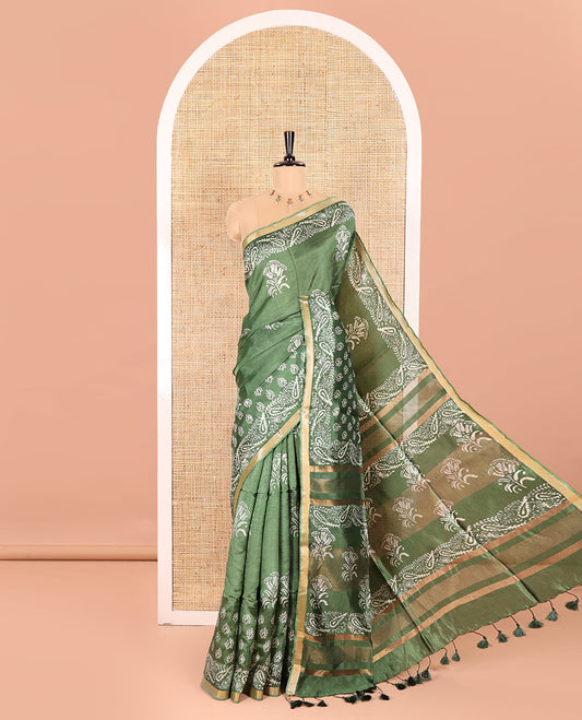 Mehendi Green Banana Pith Saree Enthralled with Floral Motifs Discharge Print All Over Its Body, Zari Bavanji Border, Pallu Subtly Woven in Floral-Paisley Print and Zari Weave, and Paired with a Matching Blouse