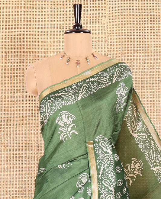 Mehendi Green Banana Pith Saree Enthralled with Floral Motifs Discharge Print All Over Its Body, Zari Bavanji Border, Pallu Subtly Woven in Floral-Paisley Print and Zari Weave, and Paired with a Matching Blouse