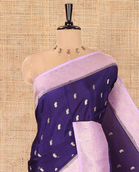 Navy Blue Russian Dola Silk Saree, Elevated with Paisley Buttas All Over Its Body, Complemented by a Contrast Traditional Zari Design Border, Pallu of Floral Jaal Designs, and Paired with a Contrast Blouse