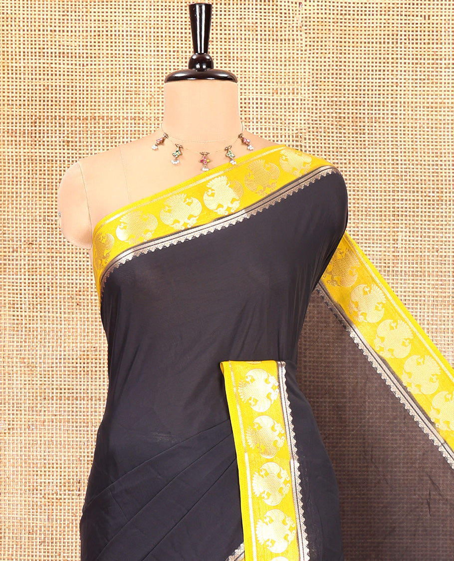 Black Plain Semi-Mysore Silk Saree, Complemented by a Contrast Border of Ganda Berunda Designs, Zari Striped Pallu, and Paired with a Contrast Blouse