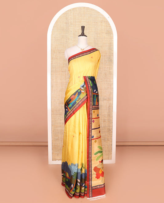 Yellow floral motifs with colorful Village-theme motifs printed saree, contrast printed border, and Village-theme auspicious motifs printed pallu