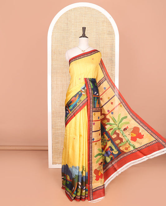 Yellow floral motifs with colorful Village-theme motifs printed saree, contrast printed border, and Village-theme auspicious motifs printed pallu