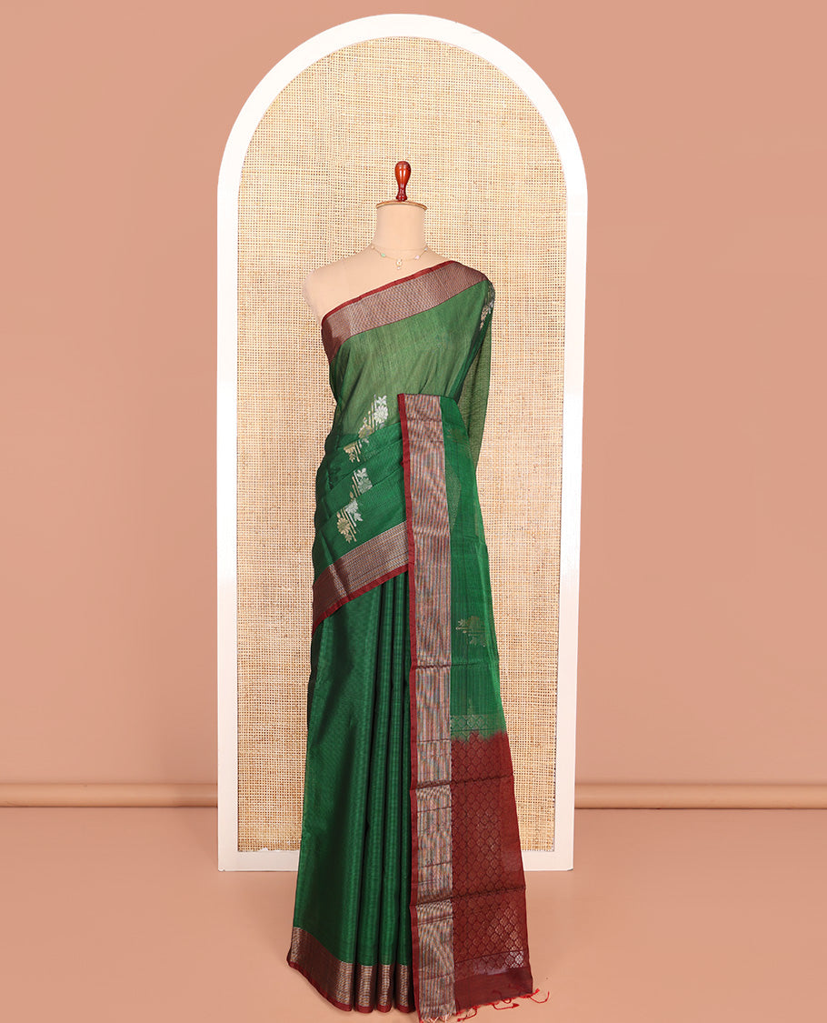 Green Silk Cotton Saree, Adorned with Floral Buttas All Over Its Body, Complemented by a Contrast Zari Striped Border, Pallu of Jaal Designs, and Paired with a Contrast Blouse