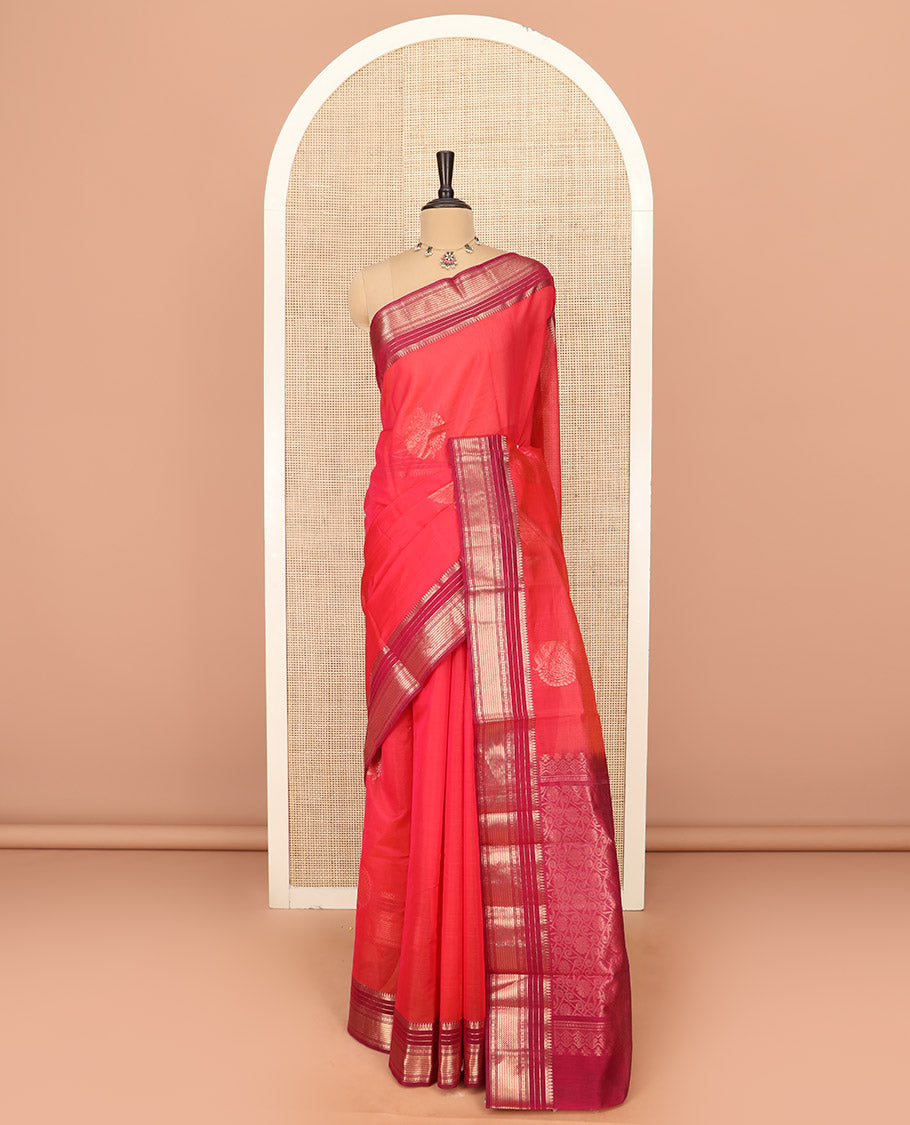 Red Silk Cotton Saree Accentuated with Zari Buttas All Over the Body, Complemented by a Contrast Border of Traditional Zari Designs, Featuring a Pallu of Floral and Geometric Zari Designs, and Paired with a Contrast Blouse