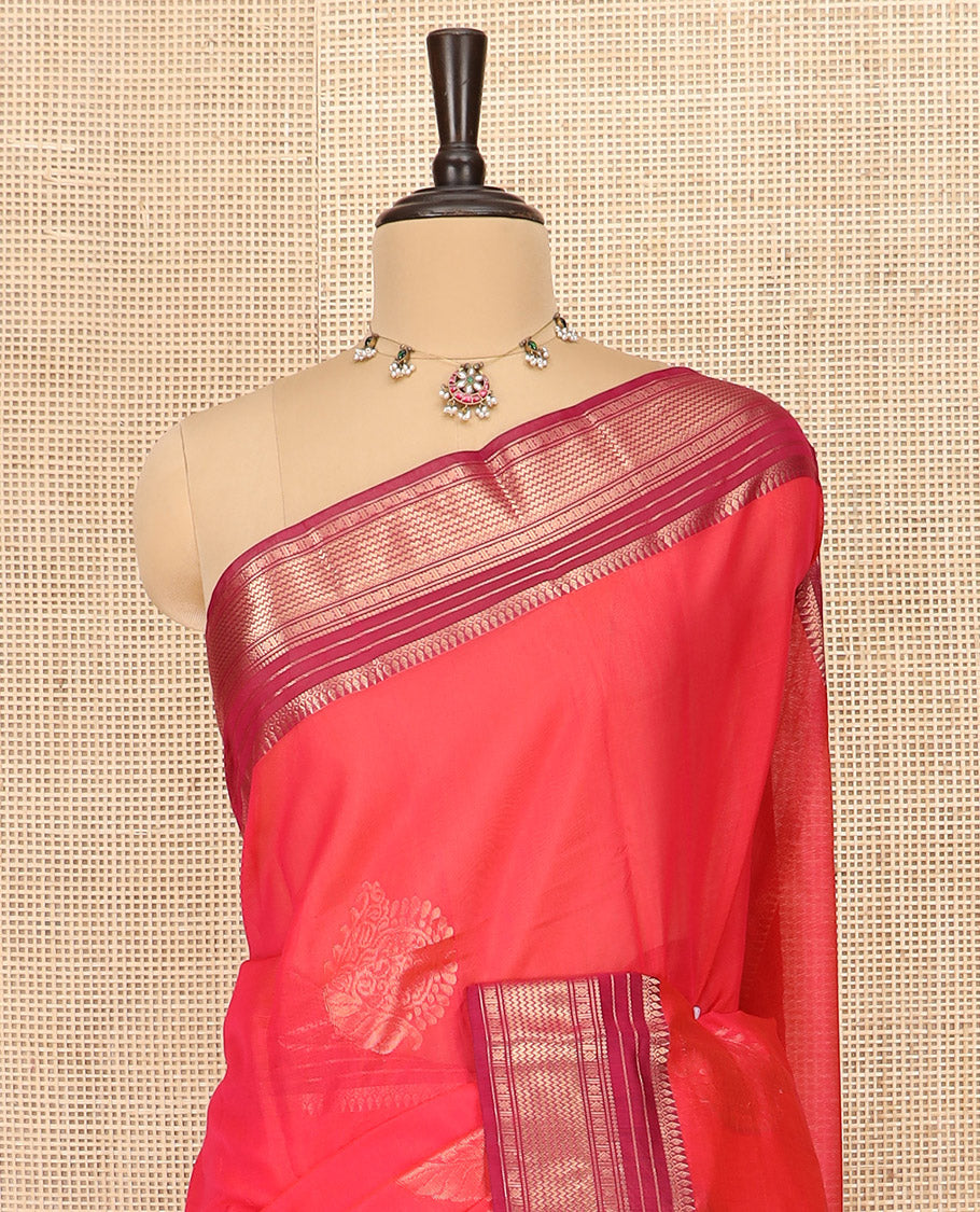 Red Silk Cotton Saree Accentuated with Zari Buttas All Over the Body, Complemented by a Contrast Border of Traditional Zari Designs, Featuring a Pallu of Floral and Geometric Zari Designs, and Paired with a Contrast Blouse