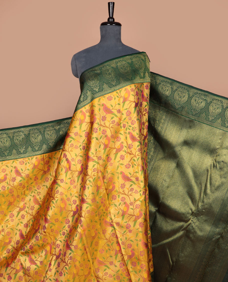 Yellow floral & bird meenakari jacquard silk saree, contrast rekku border of mayil designs & grand zari-rich intricate pallu