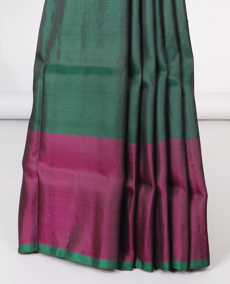 Green paisley motifs semi-soft silk saree with contrast border & pallu of intricate zari design pallu