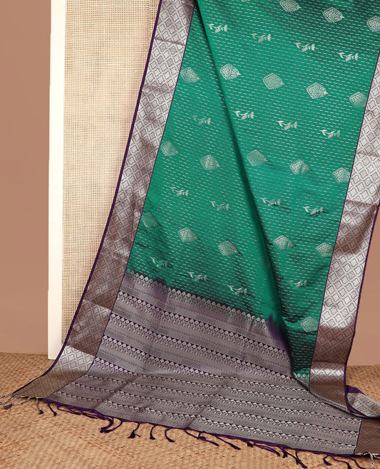Green zari designs soft silk saree, contrast jaal zari border, and pallu of traditional zari designs