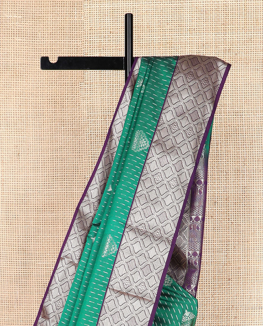 Green zari designs soft silk saree, contrast jaal zari border, and pallu of traditional zari designs