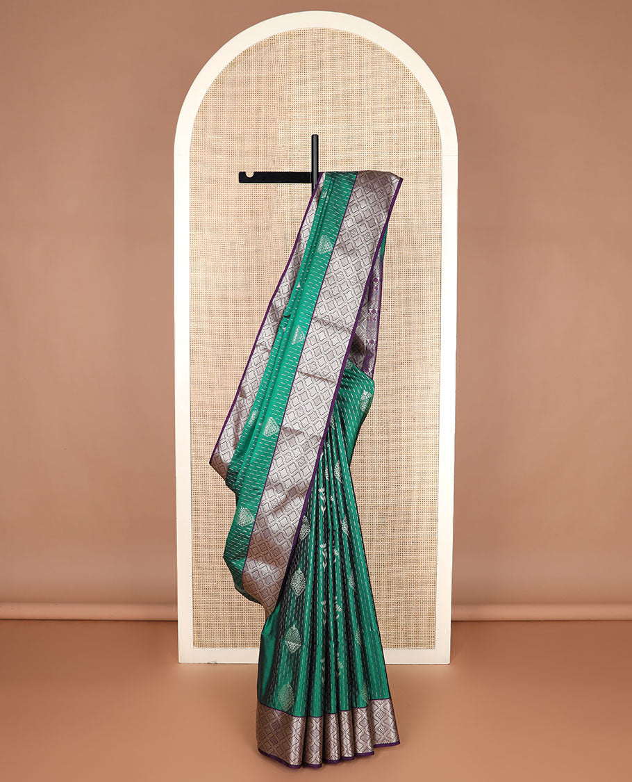 Green zari designs soft silk saree, contrast jaal zari border, and pallu of traditional zari designs