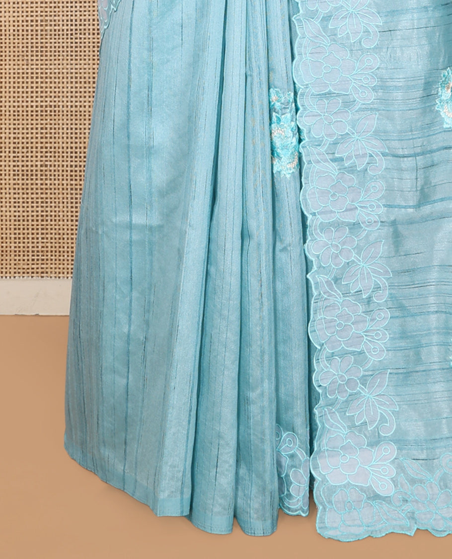 Blue Tussar Silk Saree Features Stripes and Floral Embroidery, a Scallop-Embroidered Border, and a Matching Blouse