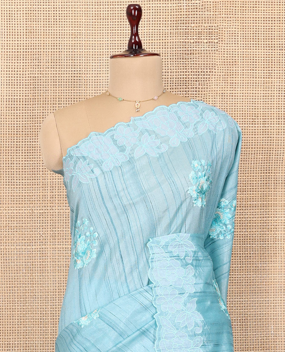 Blue Tussar Silk Saree Features Stripes and Floral Embroidery, a Scallop-Embroidered Border, and a Matching Blouse